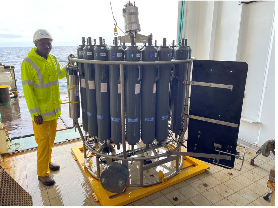 Research scientist with equipment for taking water samples from the deep ocean