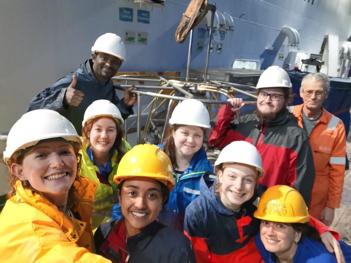 Team of scientists celebrating the last of a successful sampling programme at sea